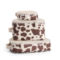 Itzy Ritzy Packing Cubes for Travel, Set of 3 Travel Organizers (Cow Print)